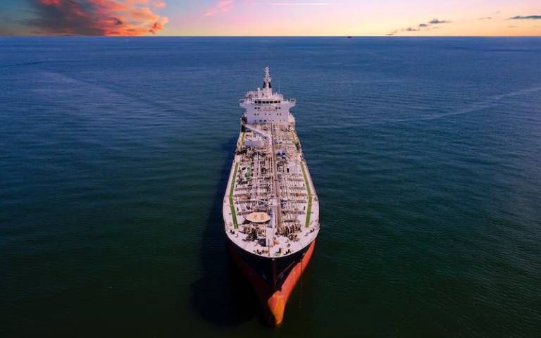 Oil tanker against sunset