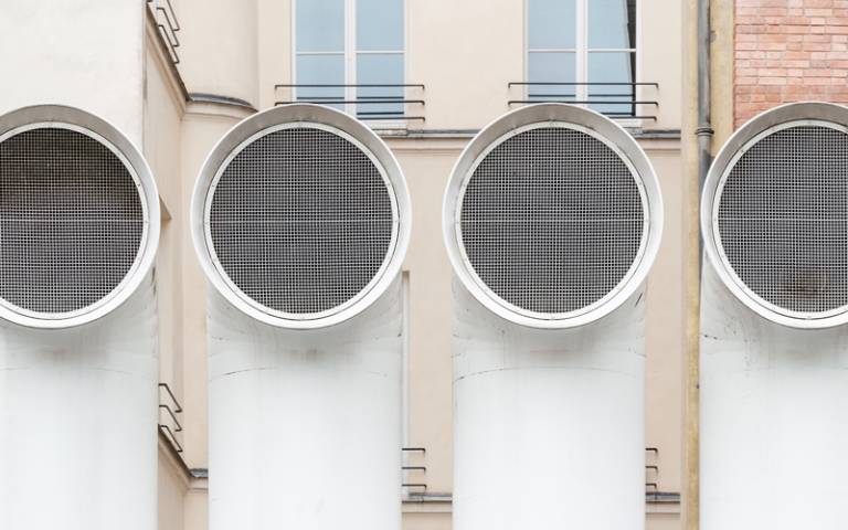 White building ventilation funnels - Photo by Samuel Zeller on Unsplash