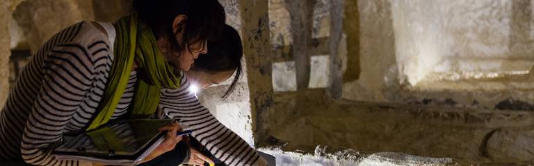 Students undertaking heritage fieldwork in catacombs