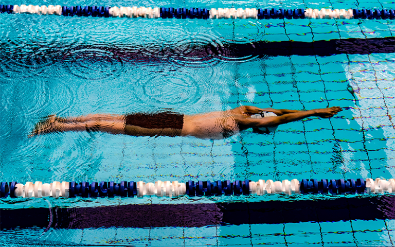 Man swimming in pool 