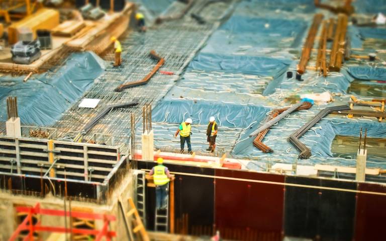 Picture of workers on a large building site