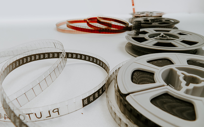 Four reel films lying on white table