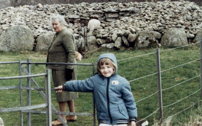 Holiday snap shows an adult and child at a stone heritage site in Scotland