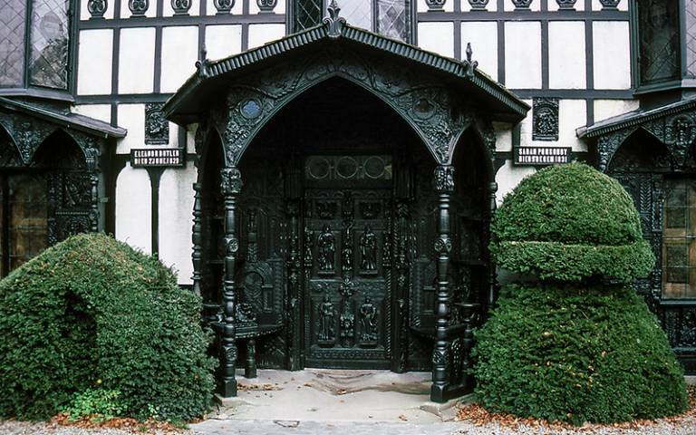  Photo showing the ornate carved oak entranceway of Plas Newydd in Wales, UK. 