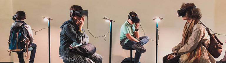 Photo of people using VR headsets in a gallery setting