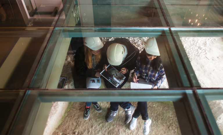 Students wearing hard hats at a heritage site in Malta