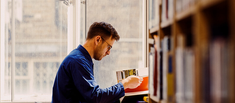 Photo of a student studying in The Bartlett library