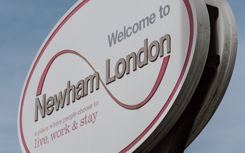 A sign reads 'Welcome to Newham London'