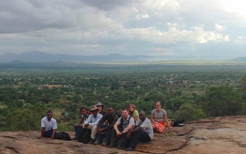 The Marakwet research team sit on a hill overlooking the landscape