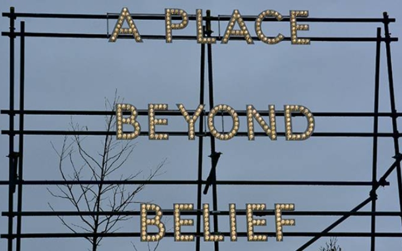 A sign reads 'A place beyond belief'