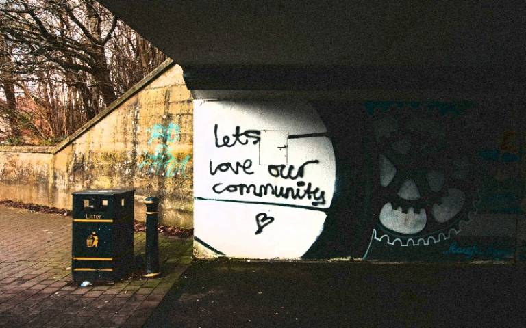 'Let's love our community' graffiti