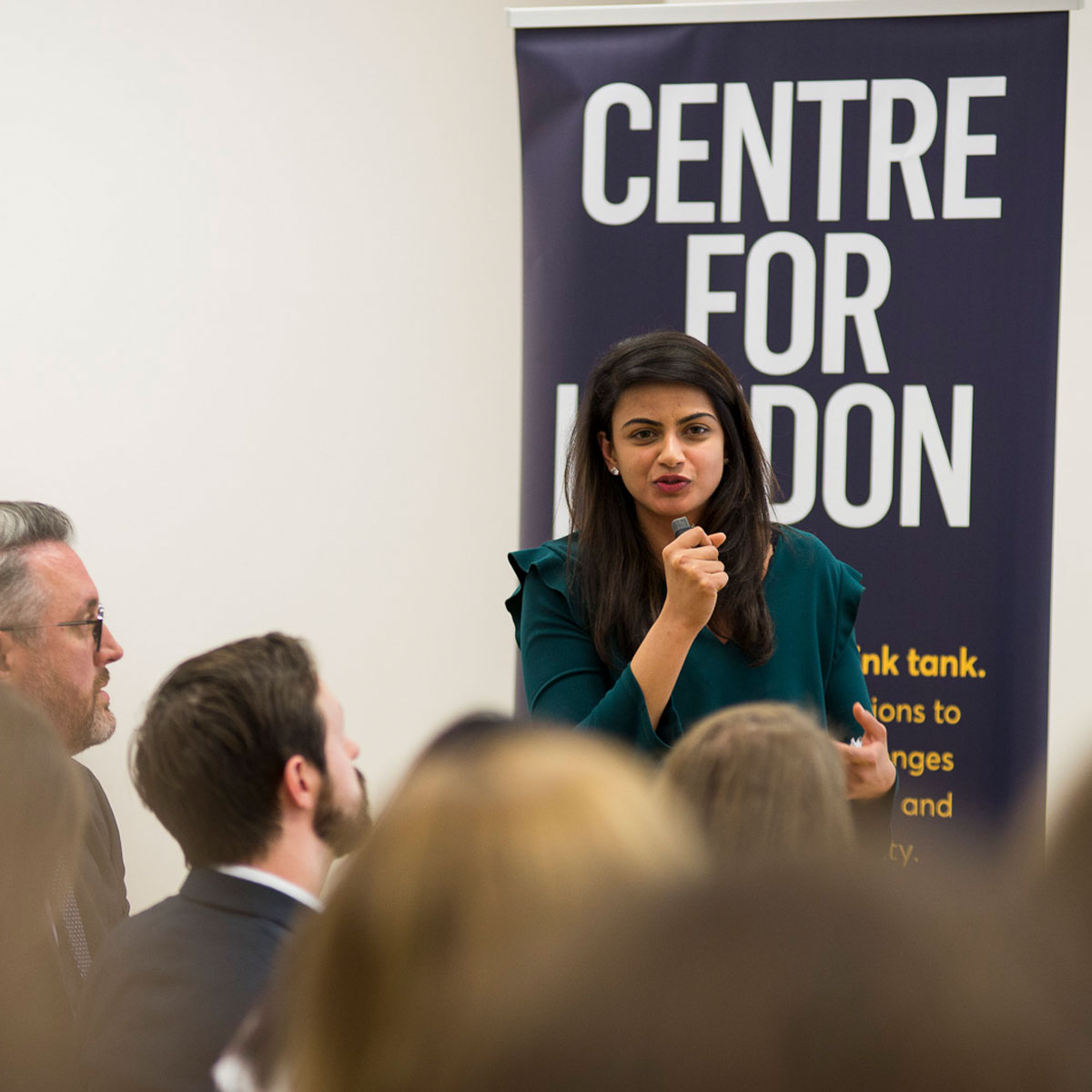 Photo of Arya speaking at an event