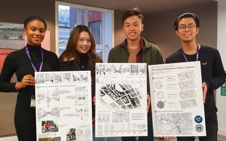 Photo of students from The Bartlett School of Planning showing posters of their work