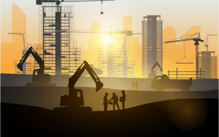Silhouette of engineer and construction team working at site over blurred background sunset pastel for industry background with Light fair