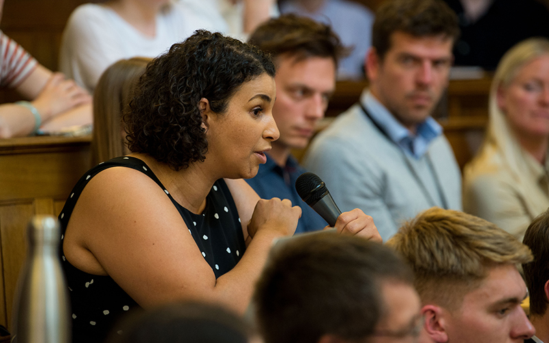 Woman asking a question at IIPP event