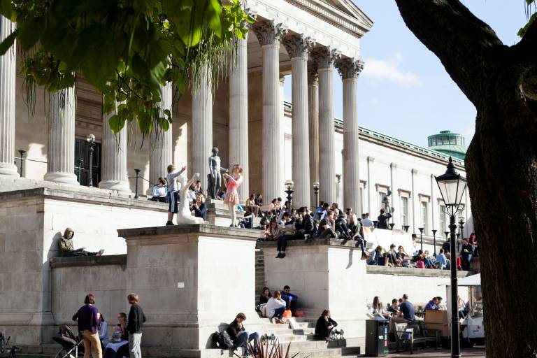 Students gathering on the steps at UCL main campus