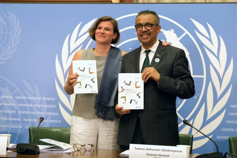 Professor Mazzucato and Dr Tedros hold up copies of the report