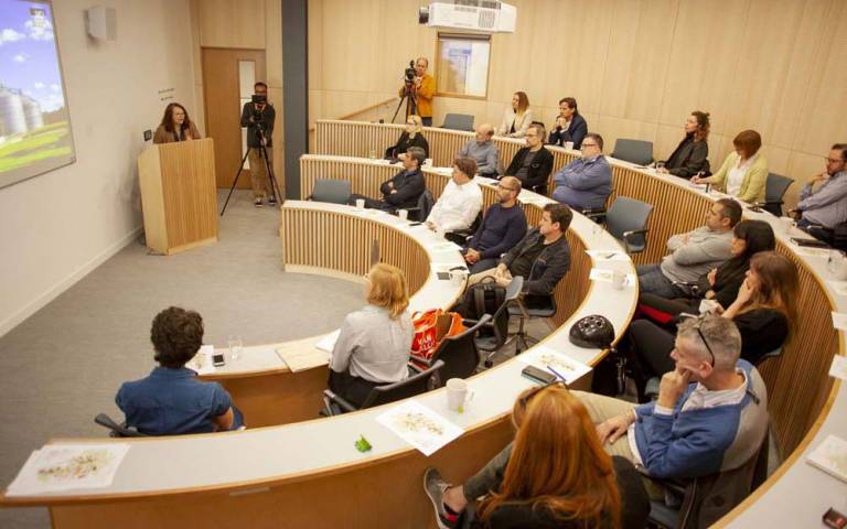 A group discussion takes place in a tiered small lecture theatre