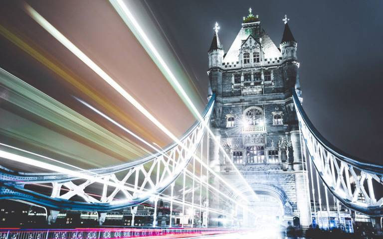 Tower Bridge in London with bright lights of vehicles crossing