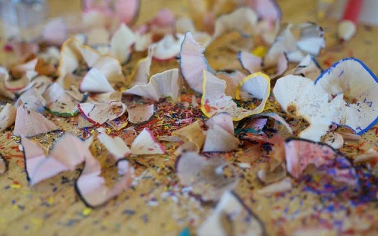 Pencil shavings in multicolours on a table top