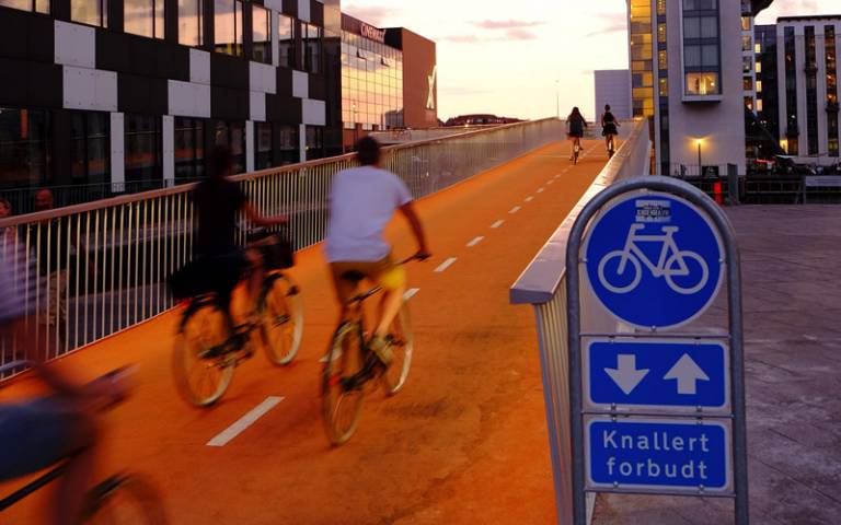 Bicycles ride across a designated cycle bridge
