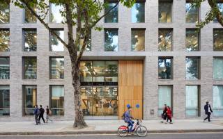 A bicycle rides past 22 Gordon Street, home of the Bartlett School of Architecture and Bartlett Faculty Office