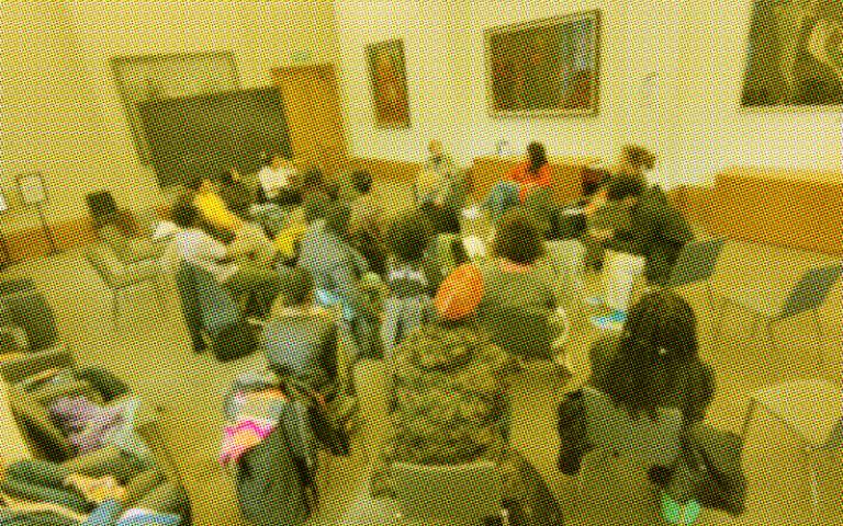 Image of discussion in classroom, with grainy filter