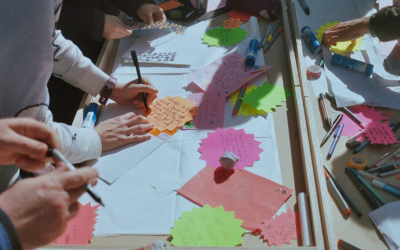 Participants during a creative workshop as part of the Research Interrupted project