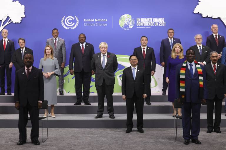 The Prime Minister Boris Johnson poses for a family photograph as he attends day two of the COP26 World Leaders Summit