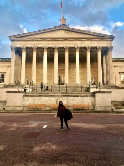 Image of student in front of Portico