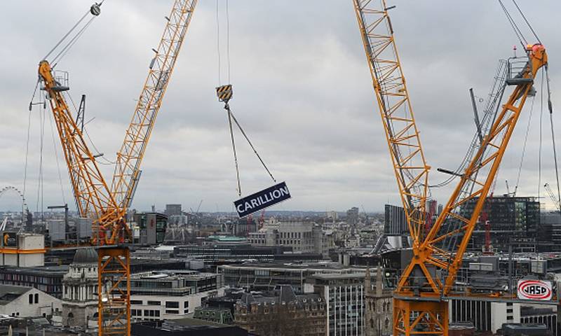 A crane with Carillion signage