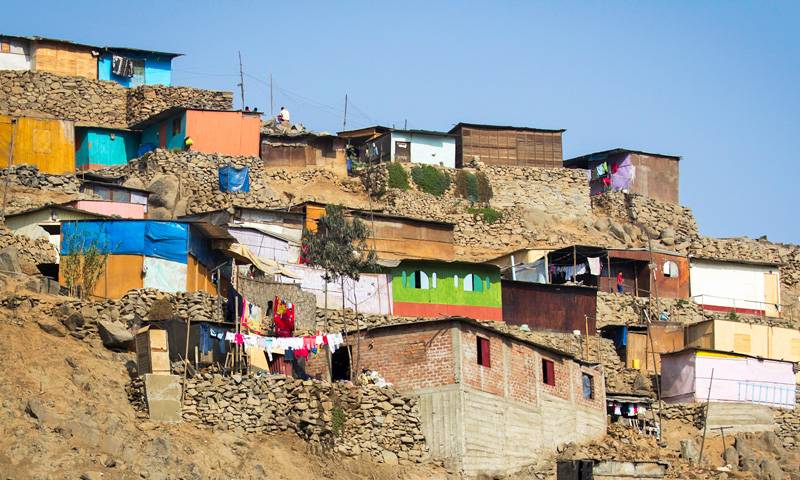 Brightly coloured buildings sit on a hillside