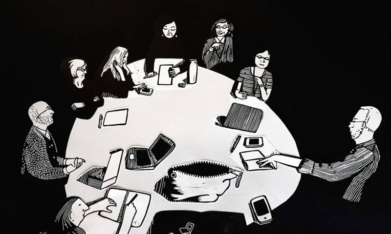 A black and white illustration of a group of people sitting around a large table having a discussion