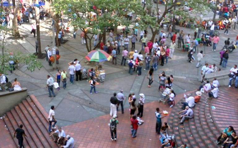 Medellin Transport Plaza is full of people relaxing and enjoying the sunshine