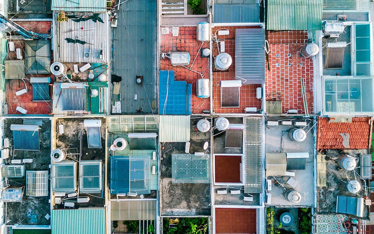 aerial view photography of houses The chaotic yet beautifully arranged rooftops of a neighborhood in Sai Gon, Vietnam