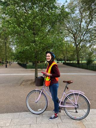 Celine riding on a bike in London