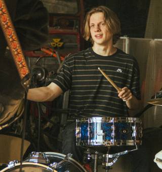 Toby playing the drums