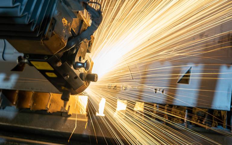 Industrial machinery with sparks flying 