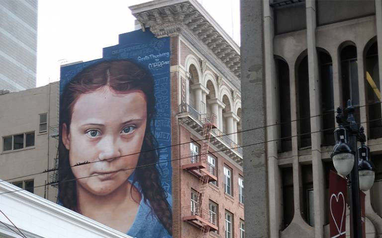 Painting of Greta Thunberg on the side of a building 