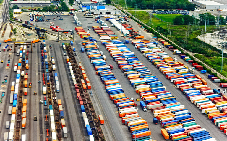 Aerial shot of lorry containers in a car park in USA
