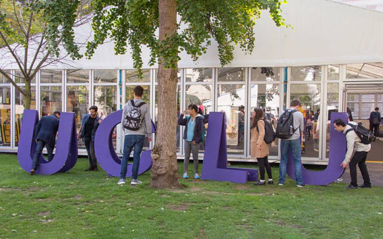 Student holding the letters UCLU for the student union