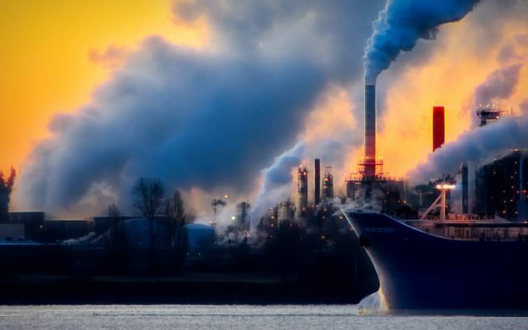 Image of industrial chimneys in a harbour