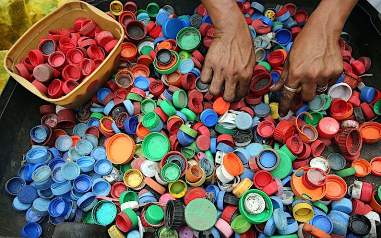 Image of plastic caps being sorted