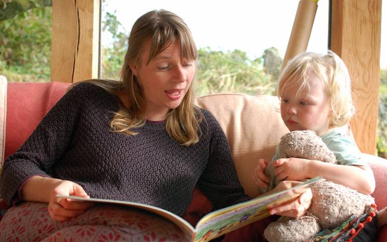 Mum reading to a child