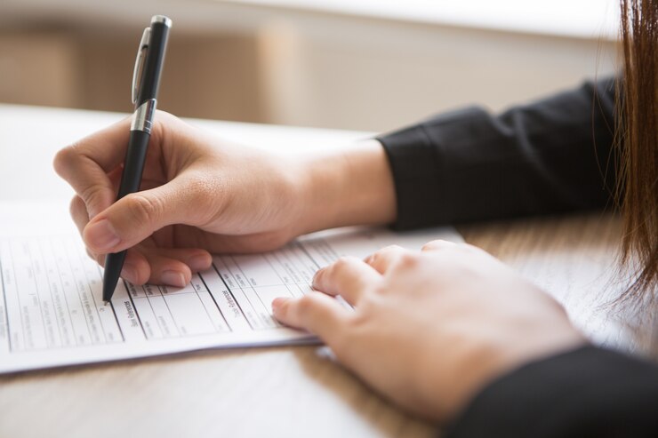 generic image of person filling in a form