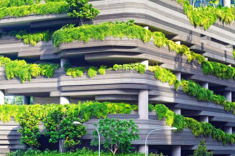 Building with plants all over it. Image by Danist Soh from Unsplash.
