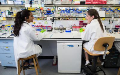 two women at a bench in a lab