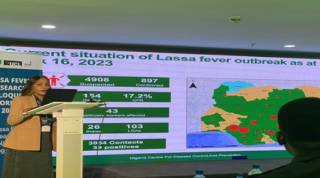 Delegate speaking at a conference about lassa fever