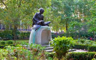 statue of thinker in park near UCL London