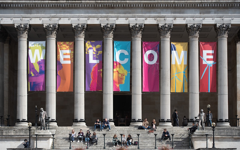 UCL portico with large multi-coloured welcome banner